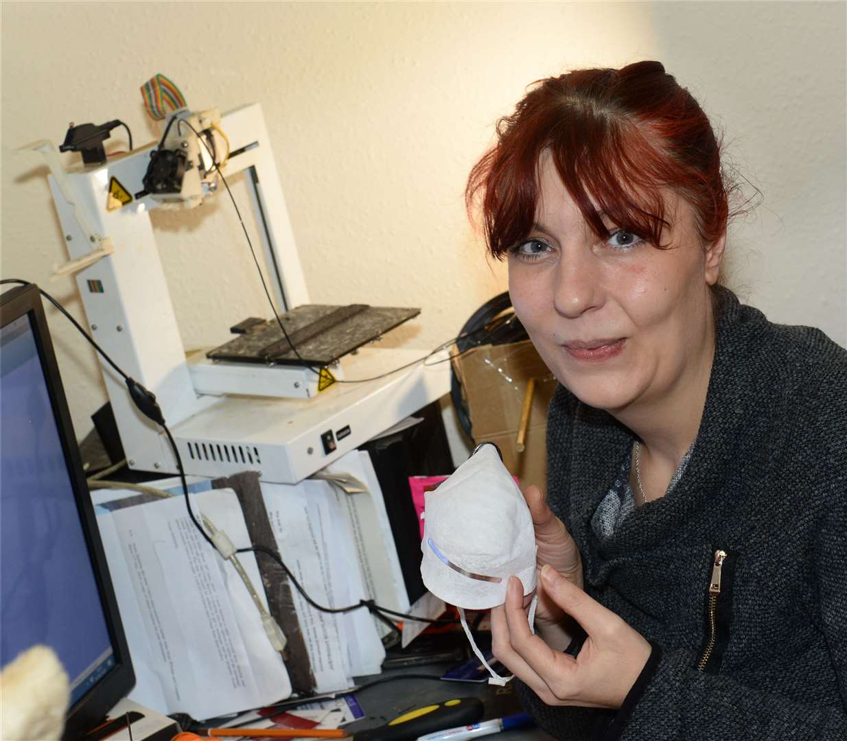 Karen-Ann Dicken and her 3D printer. Karen creates proziers,black strip attachment for face masks which prevent misting. Picture: Gary Anthony.