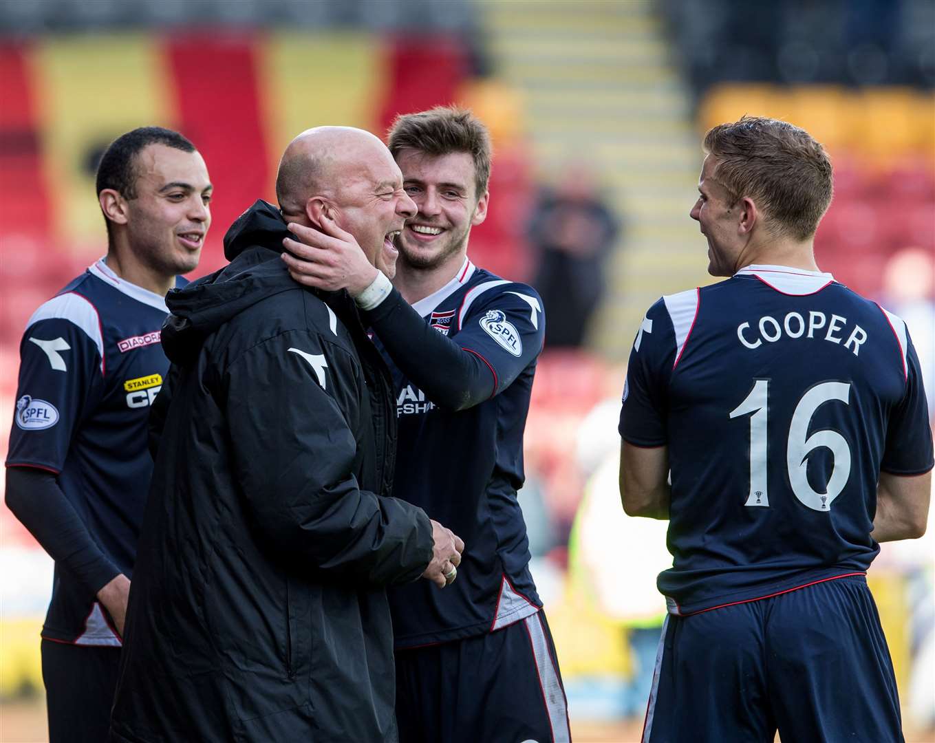 Then-Ross County assistant manager Neale Cooper celebrates the win over Partick Thistle with son Alex and Graham Carey. Picture: Ken Macpherson