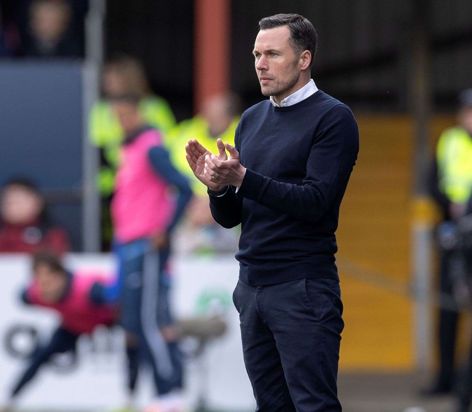 Ross County interim manager Don Cowie applauds his team in the win over Rangers. Picture: Ken Macpherson