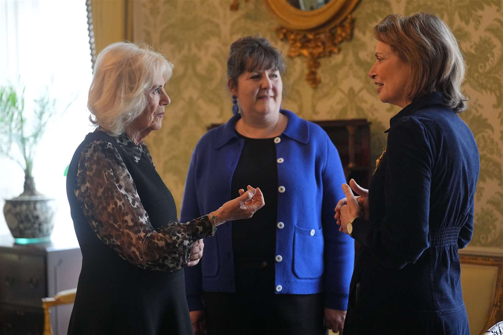 Queen Camilla with SafeLives chief executive Ellen Miller and chair of trustees Isabel Boyer (Yui Mok/PA)