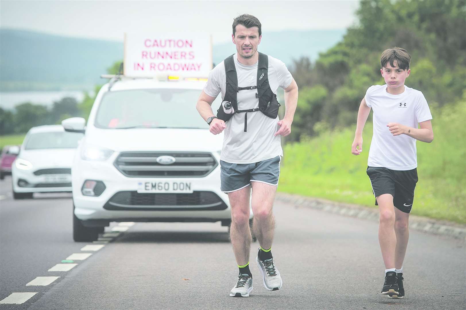 Steven Mackay and his son Dylan during a previous fundraising run. Picture: Callum Mackay