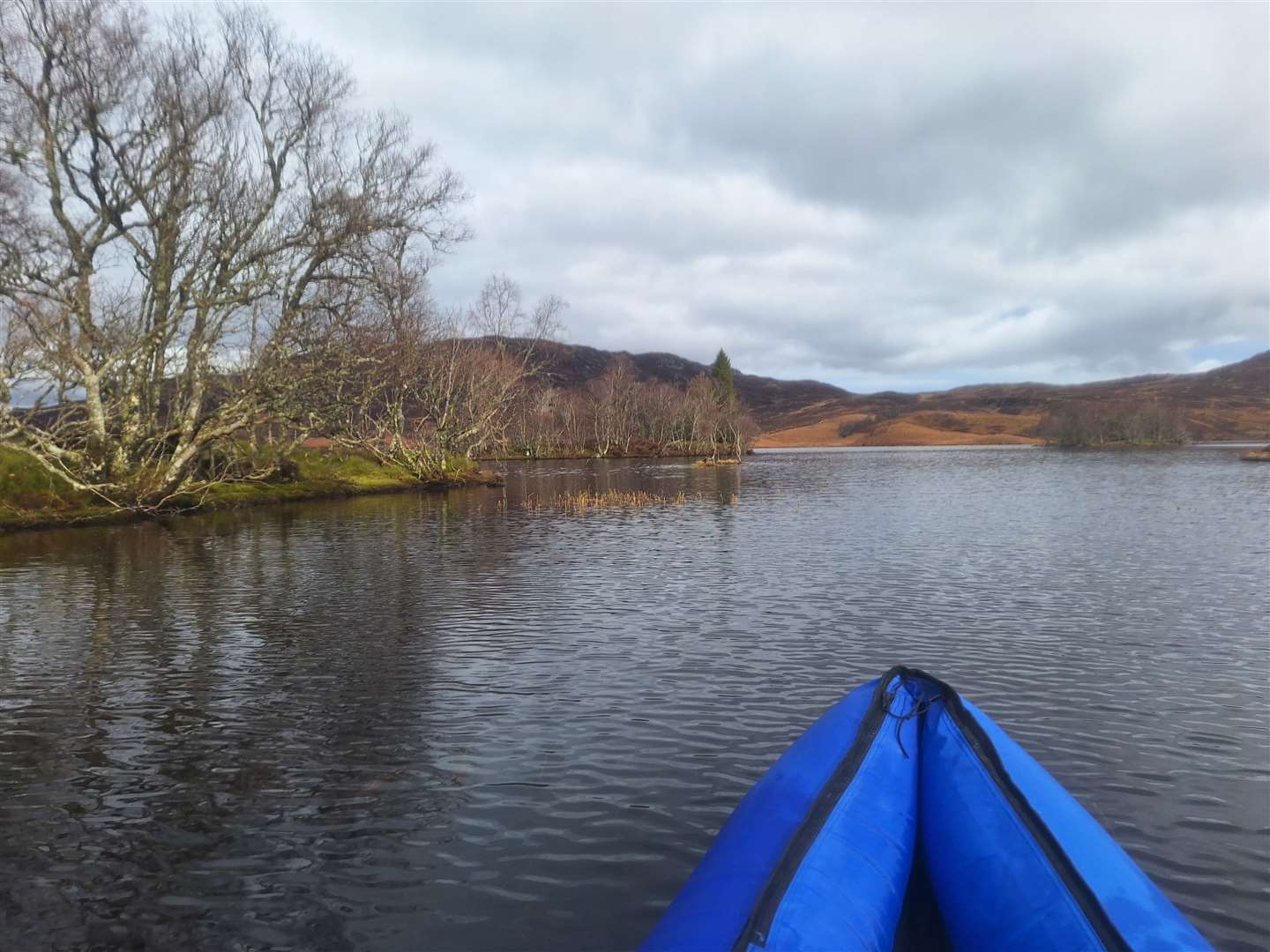 Paddling past the islands at the southern end of the loch.