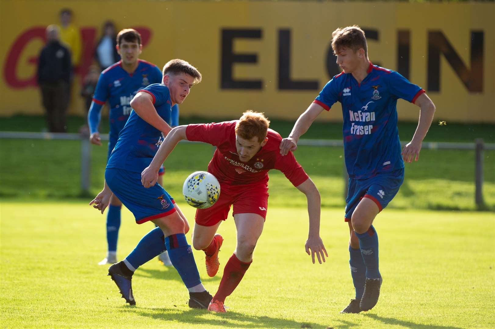 Pat Munro North of Scotland Cup Final, Mosset Park Forres...Brora Rangers v Inverness Caley Thistle..Despite the attention Brora wideman Greg Morrsion comes away with the ball...Picture: Callum Mackay. Image No..