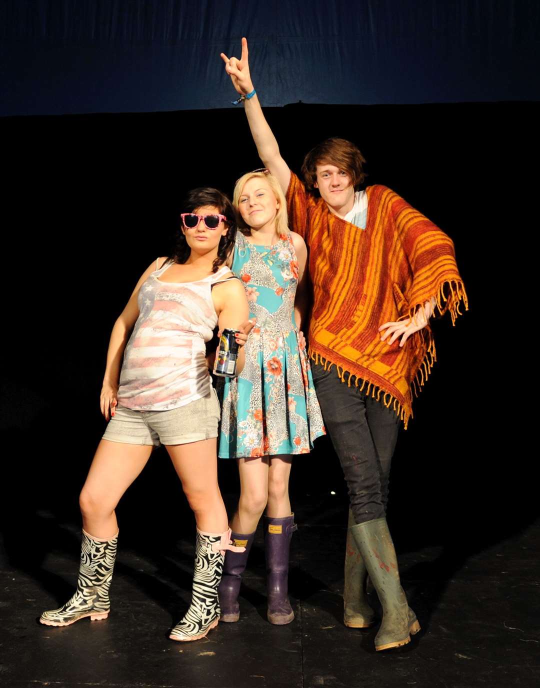 Isla Gillespie from Evanton, Nicole Begg from Alness and Stuart Howie from Largs strike a catwalk pose in the Ciao Bella fashion tent in 2012. Picture: Alison White