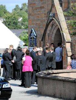 Mourners arrive at the funeral of little Grace Mackay.