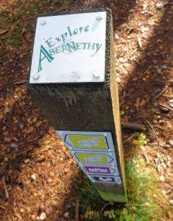 One of the Explore Abernethy signposts which direct around the local trails.