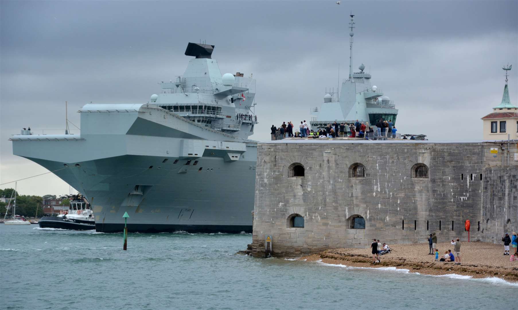 Royal Navy aircraft carrier HMS Queen Elizabeth leaving Portsmouth Harbour in July last year (Ben Mitchell/PA)