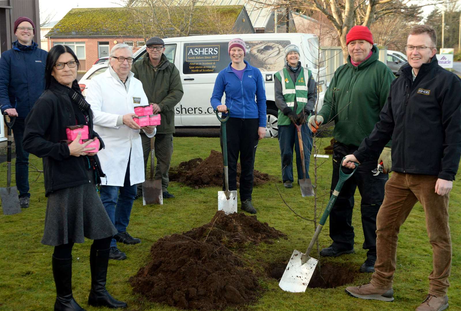 Ashers bakers take up an offer from Des Scholes to plant some apple trees in their ground at Balmakeith: Alex Williamson, volunteer, Avril Good, Ashers Office Admin, Stephen Keenan, Technical Manager, Robert Cunningham, Orchard Group, Cath Raitt, volunteer, Annie Stewart, Keeping Nairnshire Colourful, Des Scholes, Nairn Allotments Orchard Group and George Asher, Ashers Director. Picture: James Mackenzie.