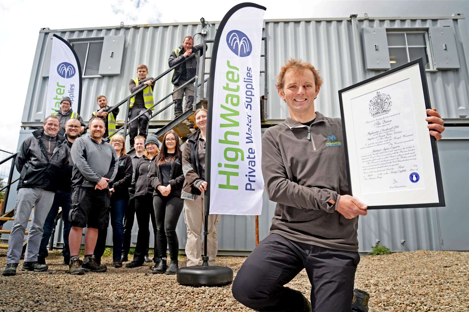 HighWater managing director Michael Ayres proudly displays their Royal Warrant, alongside some of his team. Picture: Gair Fraser. Image No. 044028