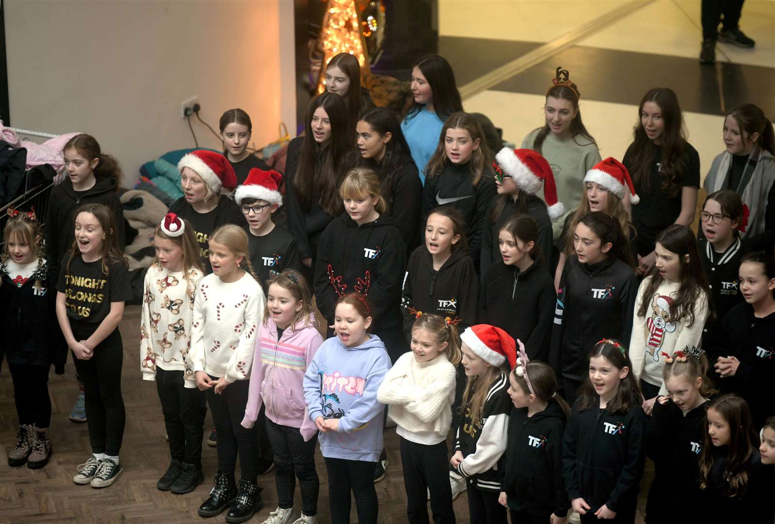 TFX choir inside the Eastgate Shopping Centre. Picture: James Mackenzie.