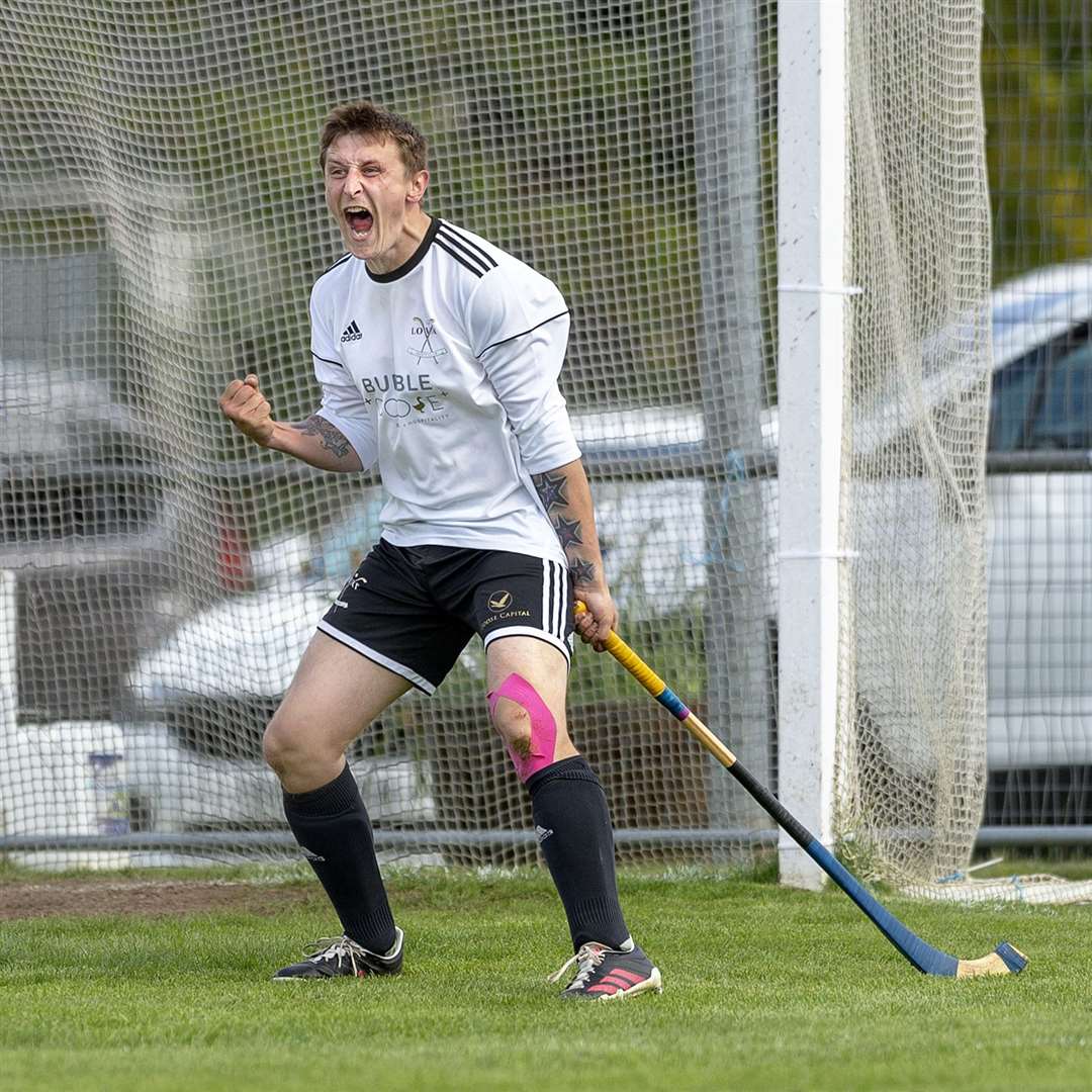 An ecstatic Fraser Heath (Lovat) celebrates the winning goal and his hat-trick. Newtonmore v Lovat in the Tulloch Homes Camanachd Cup 2nd Round, played at The Eilan, Newtonmore.