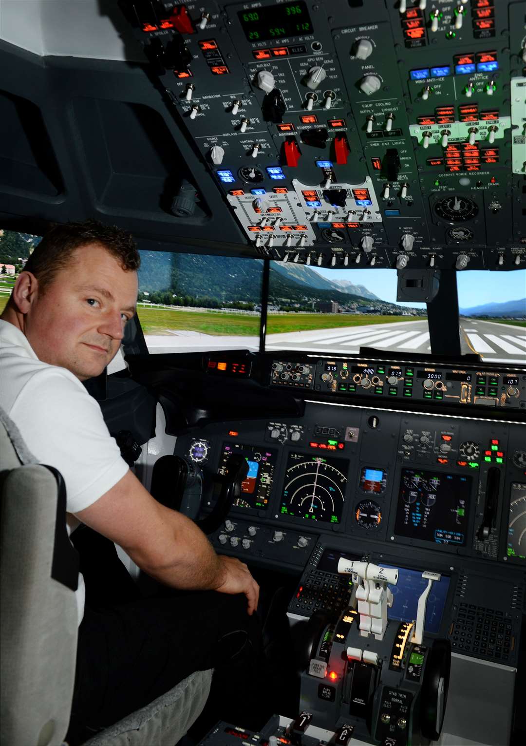 Krystian Rabiej has built a full scale 737 cockpit simulator, pictured flying into Innsbruck. Picture: Gary Anthony