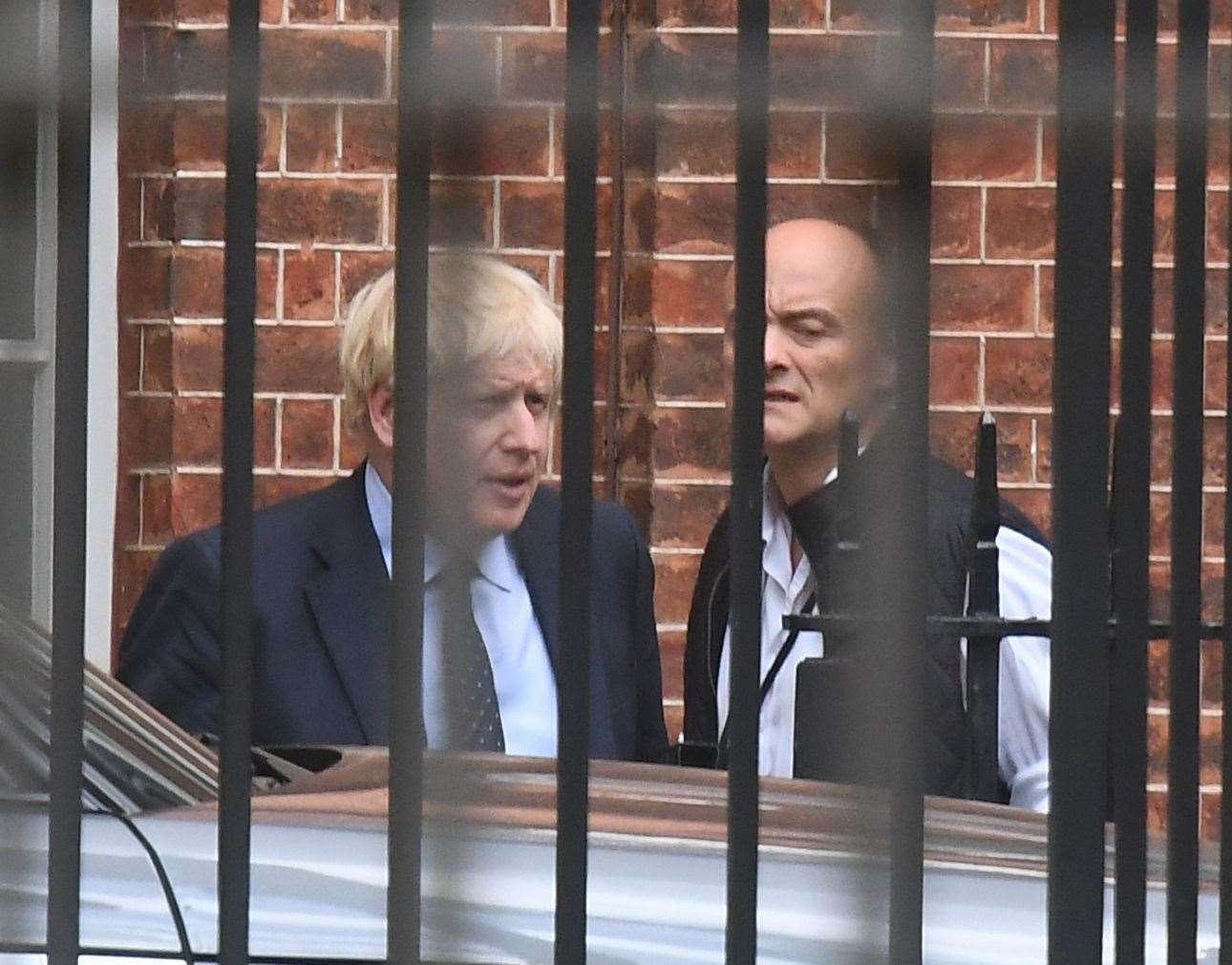 Prime Minister Boris Johnson with his senior advisor Dominic Cummings as they leave Downing Street. Photo credit should read: Victoria Jones/PA Wire.
