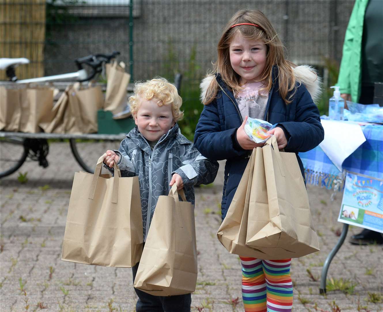 Struan and Lily Macdonald with their bags.
