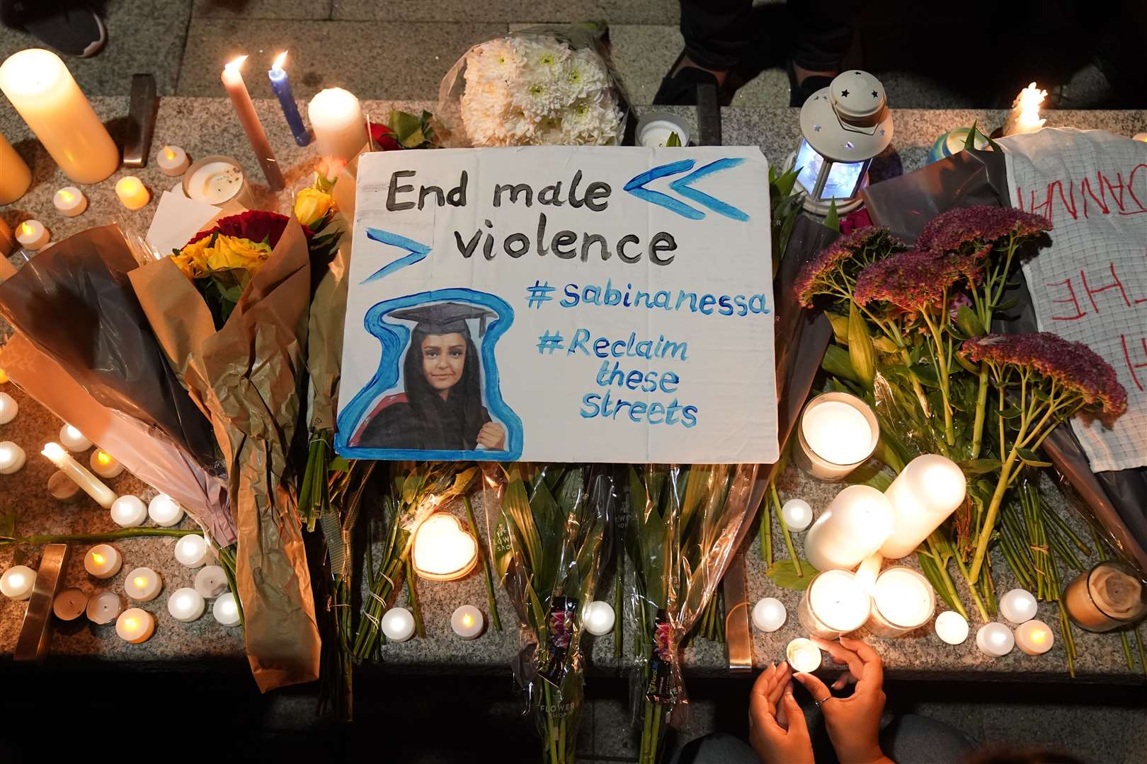 Messages were left among flowers and candles (Jonathan Brady/PA)