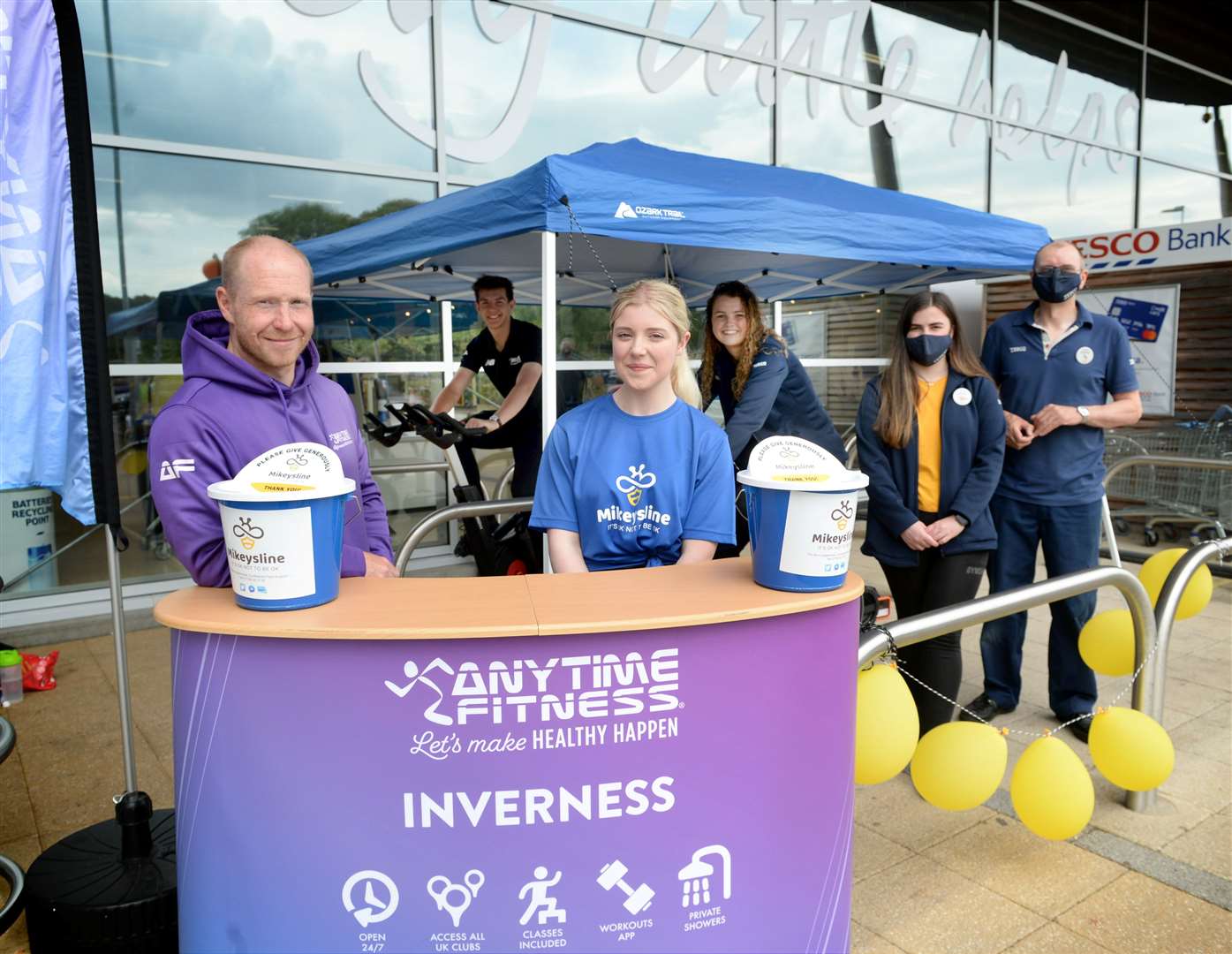 The new gym Anytime Fitness, Inverness, is helping run a charity static cycle fundraiser in aid of Mikeysline inside the Dores Road Tesco. Pictured are: Ally Pollock, Gym Club Manager; Andy Tate, PT; Grace Poston, PT; Florrie Malcolm, checkouts; Kathryn Cooper, Community Champion; and Andrew Muir, fresh produce. Picture: James Mackenzie.