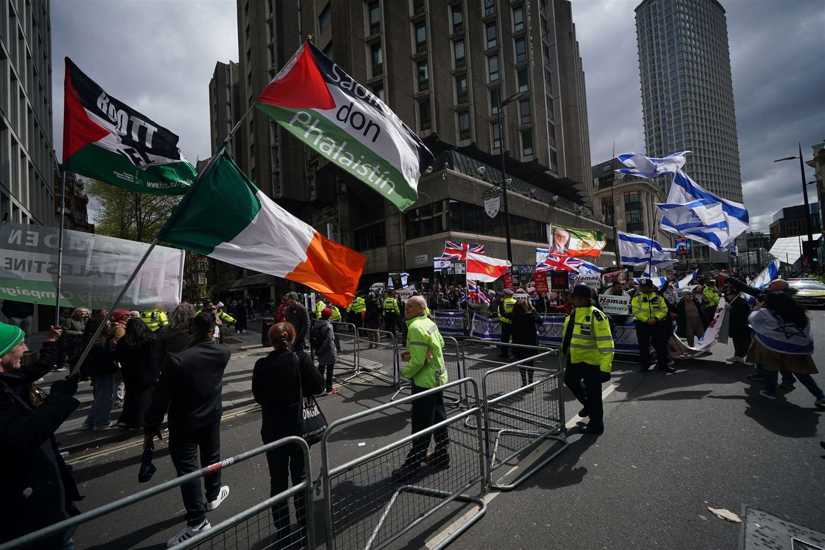 Pro-Israel supporters and pro-Palestine supporters hold opposing demonstrations in Tottenham Court Road, in central London (Yui Mok/PA)