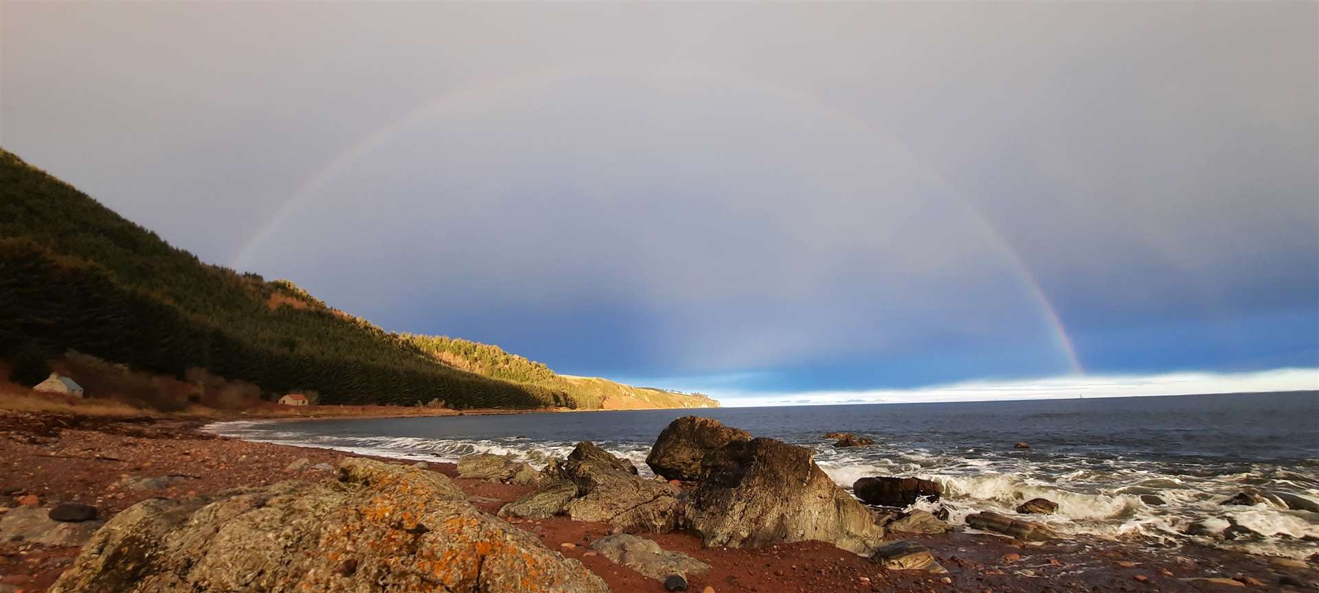 A rainbow frames the view from Eathie Haven.