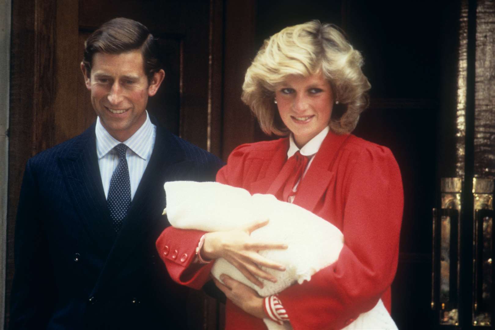 The then-Prince and Princess of Wales leaving hospital with newborn baby Prince Harry (PA)