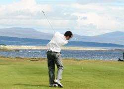 John Forbes tees off at the 17th at Royal Dornoch as he strives to win the Carnegie Shield.