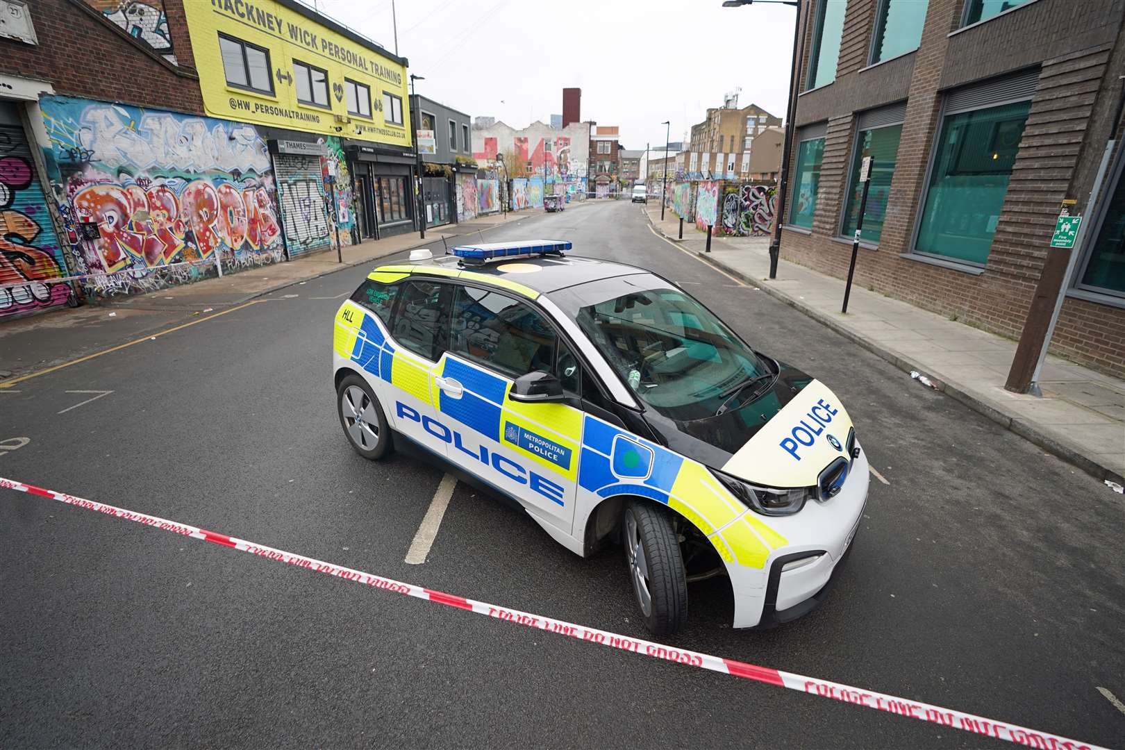 A police car near the scene at White Post Lane, Hackney Wick (James Manning/PA)