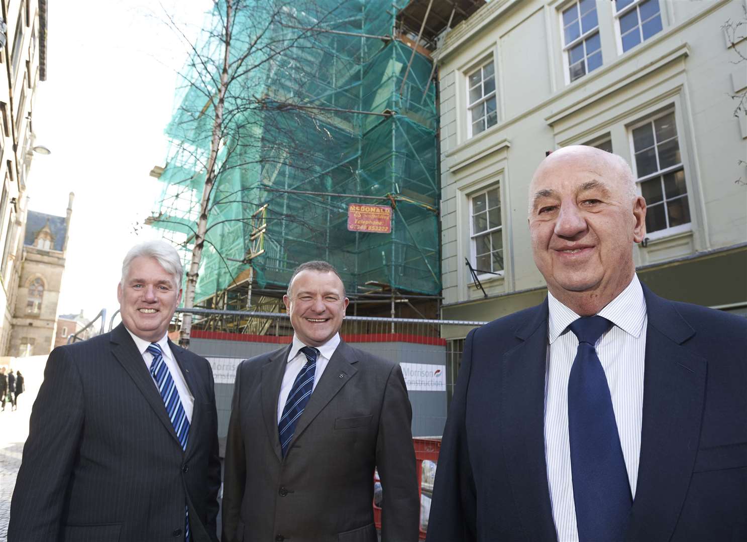 From left: Councillor Ian Brown, MP Drew Hendry and John McClelland (Skills Development Scotland) visit the building during the work at 1-5 Church Street.