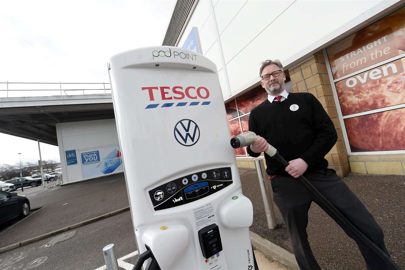 Tesco celebrates 500th EV charging network milestone at Inverness Inshes store...Deputy Manager Billy Morrison....