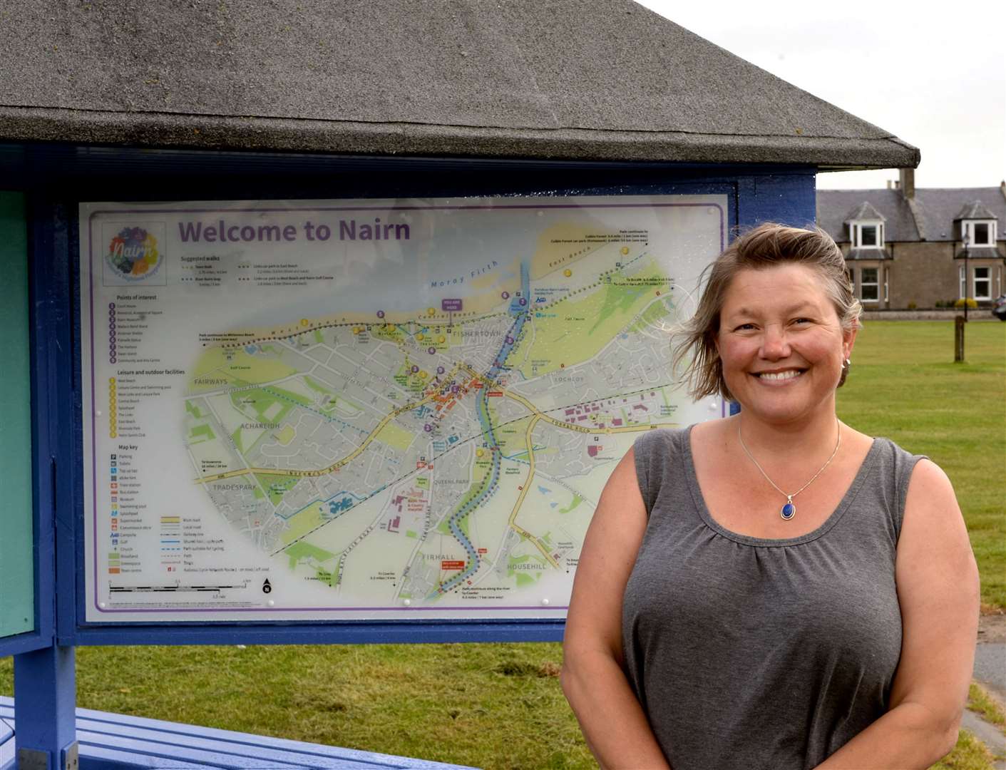 Lucy Harding, Nairn BID Manager in front of one of the Nairn shelters/information boards. Picture: James Mackenzie.