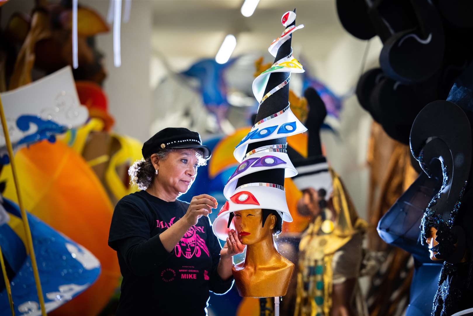 Clary Salandy adjusts a costume for the first virtual Notting Hill Carnival at her shop in Harlesden, north London (Aaron Chown/PA)
