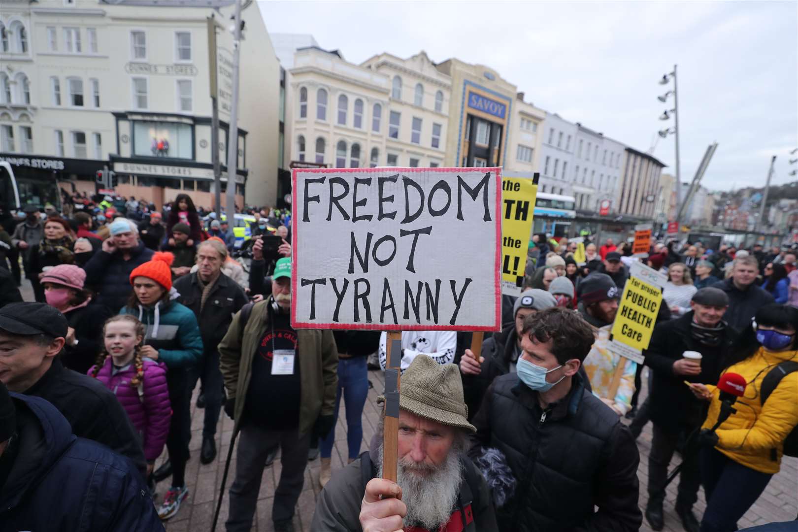 People part in a demonstration against lockdown restrictions organised by the People’s Convention in Cork city centre (Niall Carson/PA)