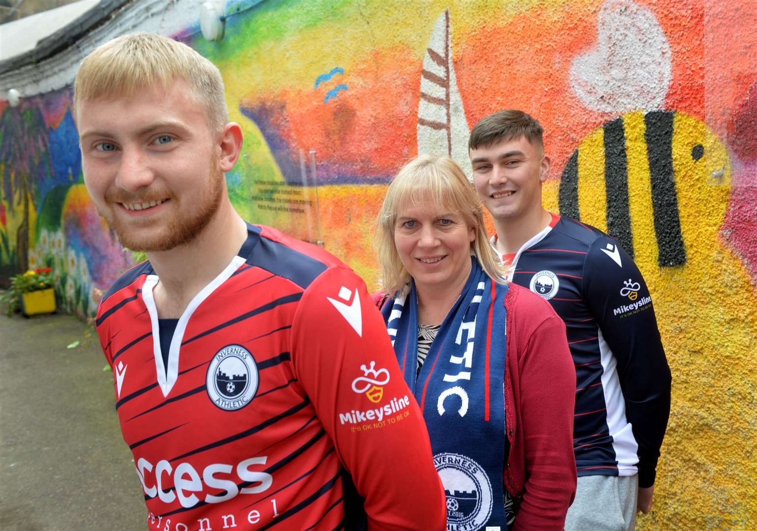 Emily Stokes, Mikeysline chief executive, with Inverness Athletic players (from left) Luke Mackay and Lennox Lauder-Smith.