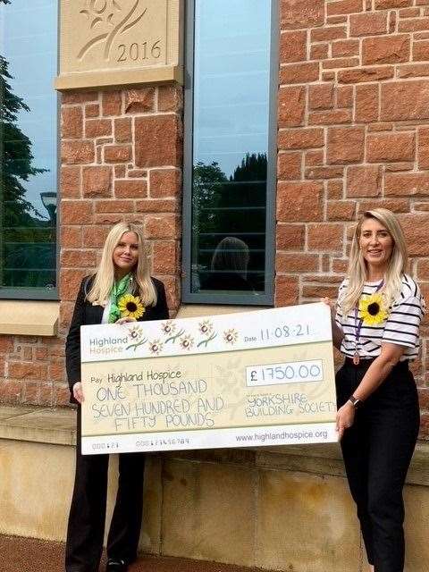 Erin Sutherland from the Yorkshire Building Society branch in Inverness presents Highland Hospice with £1,750 donation.