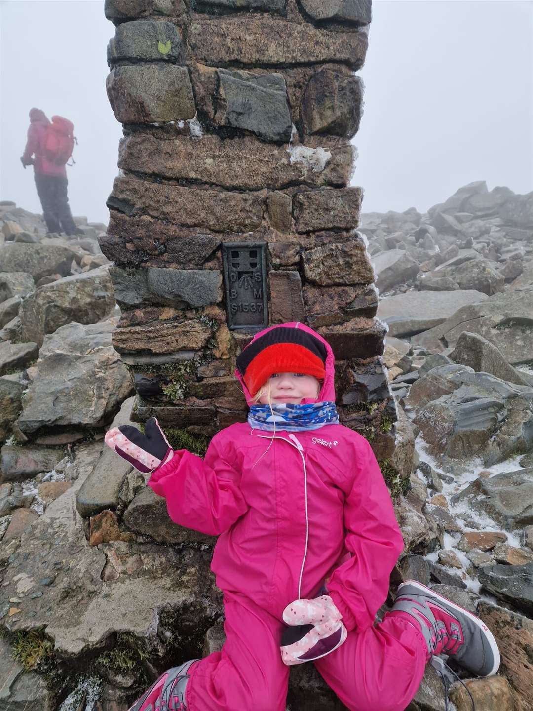 Seren reaching the top of Scafell Pike despite extreme winter conditions (Glyn Price/Just Giving)