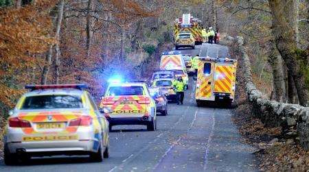 Emergency services at scene of accident on Dores road.
