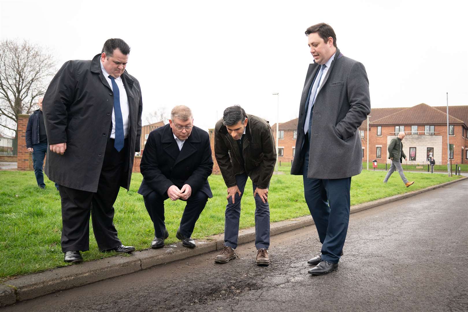 Prime Minister Rishi Sunak with Darlington Council leader Jonathan Dulston, far left, Tees Valley mayor Ben Houchen, far right, and Darlington MP Peter Gibson, second from left, in Firth Moor during a visit to Darlington, County Durham (Stefan Rousseau/PA)