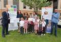 Children hand over cheques to charity groups 