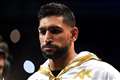 Three arrested after boxer Amir Khan robbed at gunpoint