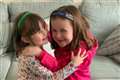 Girl achieves dream of walking sister to school after ‘life-changing’ surgery