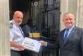 Courier petition calling for UK government to end unfair electricity charges delivered to Downing Street 