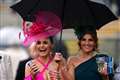 Racegoers brave downpours for Aintree’s Ladies Day