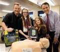Fundraising sisters donate defibrillator