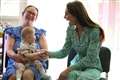 Burping baby leaves Kate in stitches on visit to children’s centre