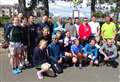 Triathletes cycle swim and run at Nairn Triathlon 2024