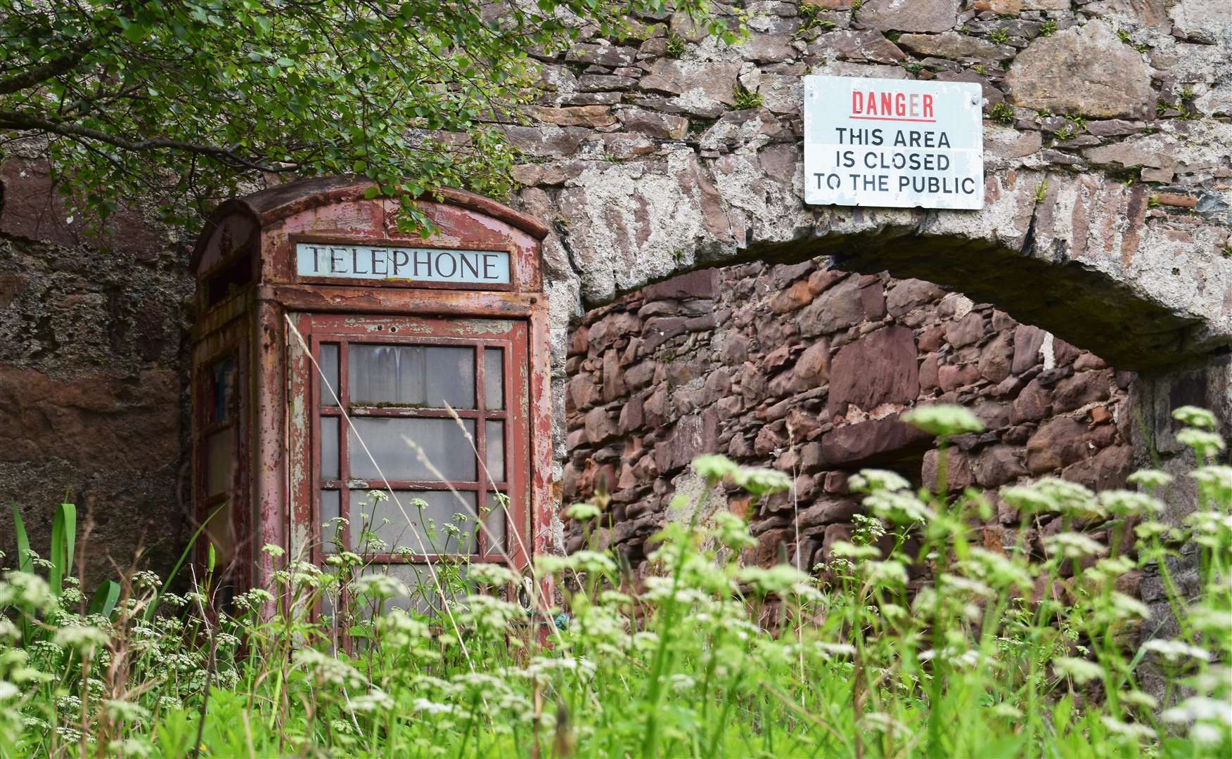 The derelict herring station and neighbouring phone box on Tanera Mor.