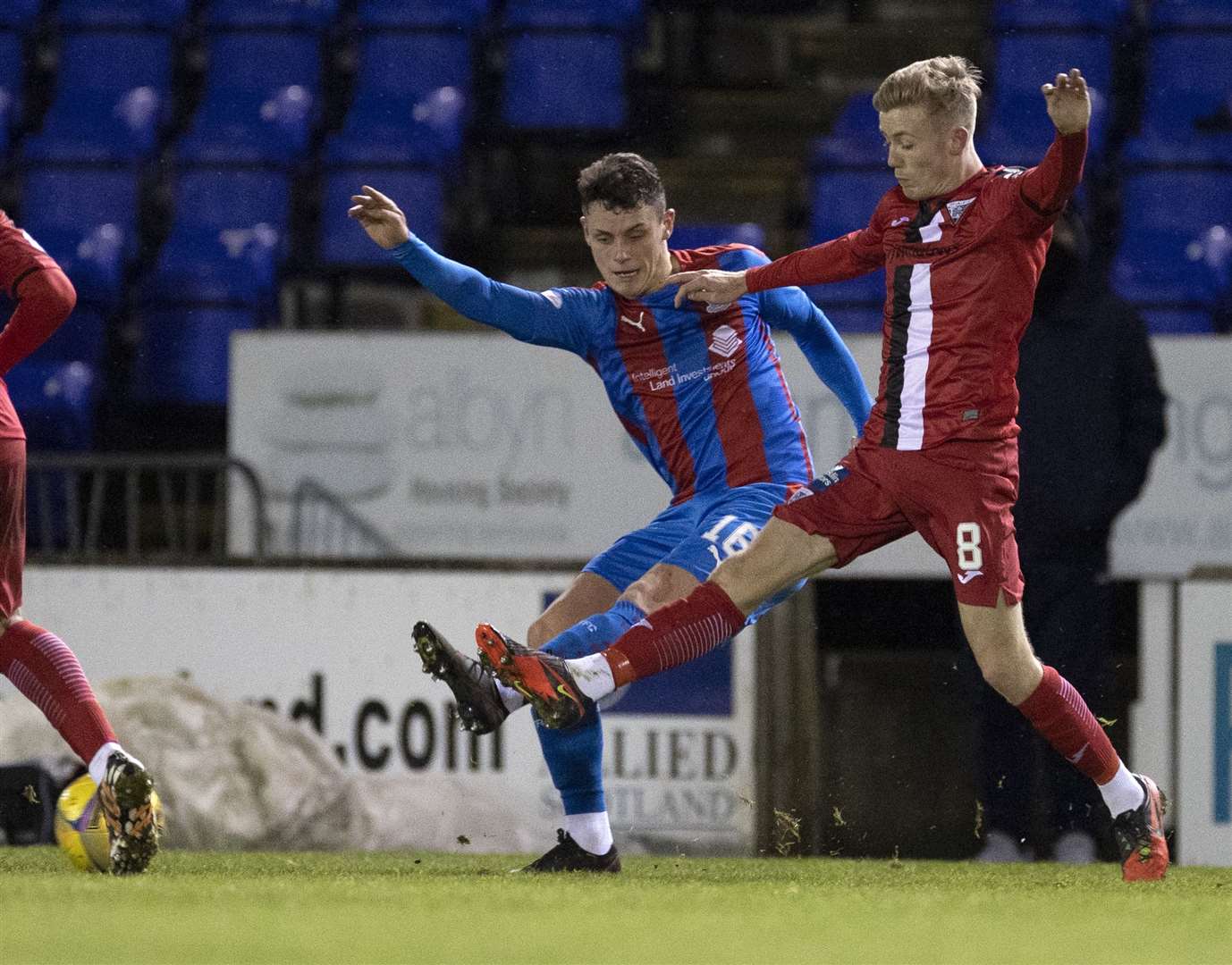 Picture - Ken Macpherson, Inverness. Inverness CT(1) v Dunfermline(1). 29.12.20. ICT’s Cameron Harper clears off the toes of Dunfermline's Kyle Turner.