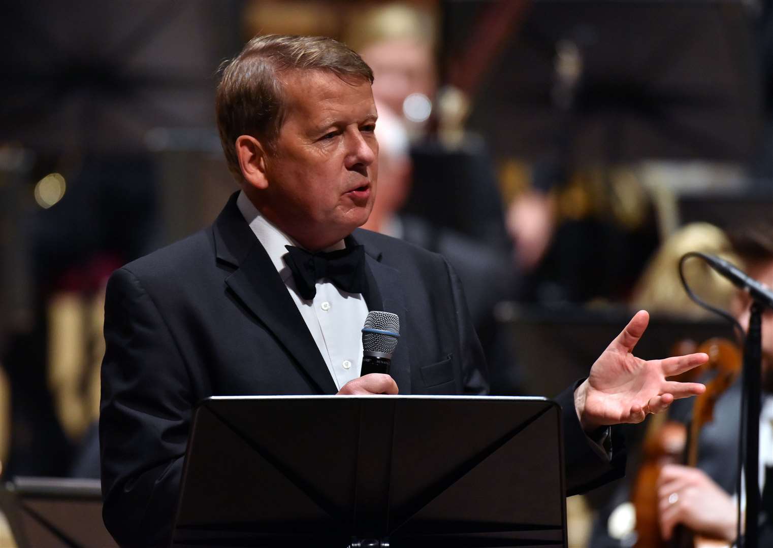 Bill Turnbull presents on stage with the Royal Liverpool Philharmonic Orchestra during Classic FM’s 25th birthday concert at the Liverpool Philharmonic Hall in 2017 (Matt Crossick/PA)