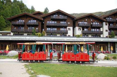 An electric battery powered tram operates in Riffelalp.