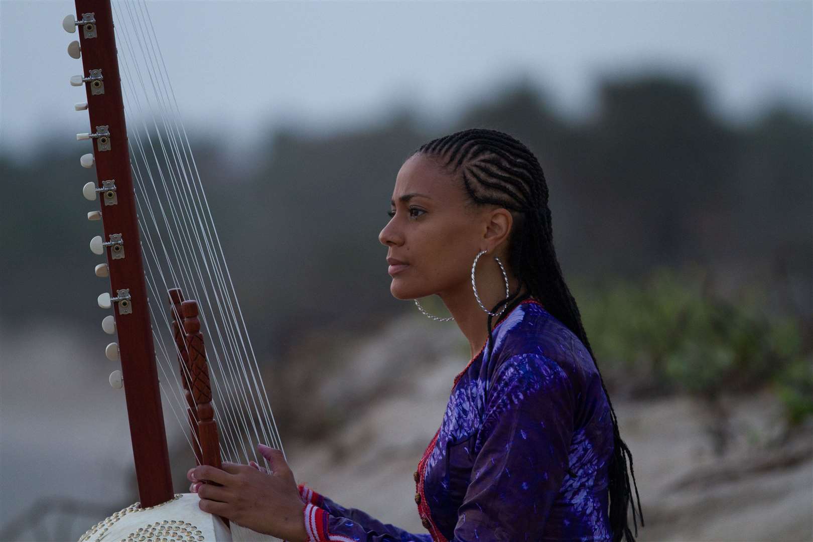 Sona Jobarteh with traditional 21-stringed West African instrument the kora.