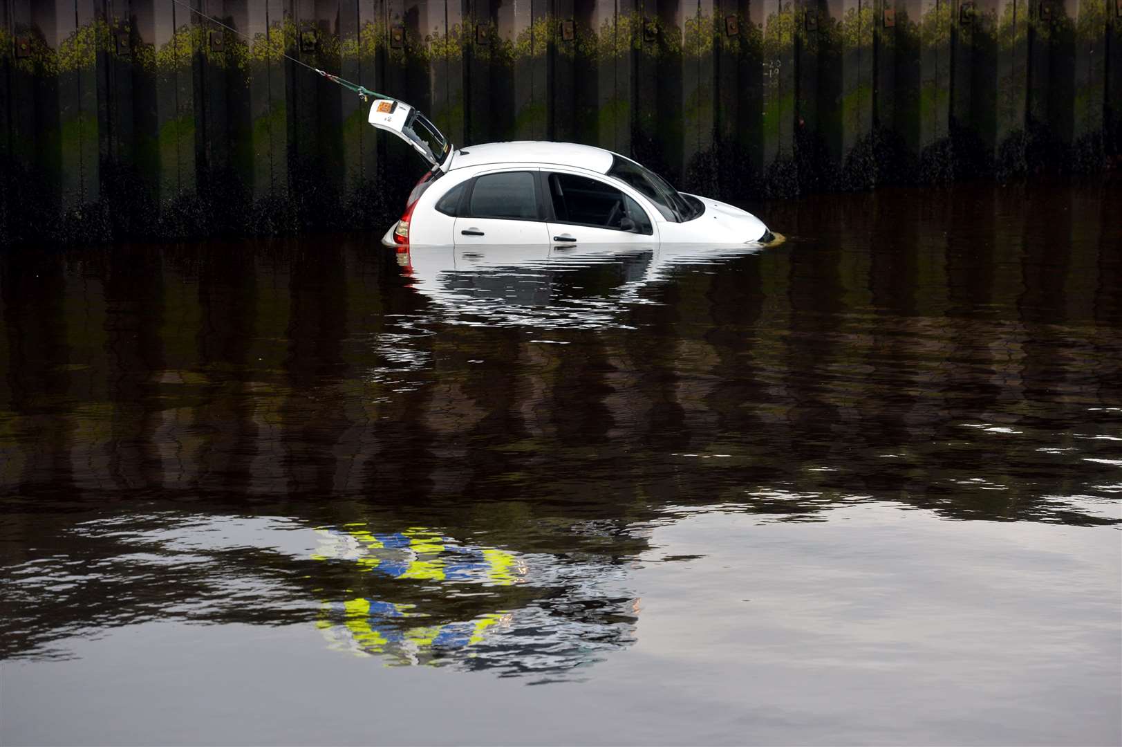 Car in the sea at Nairn harbour..