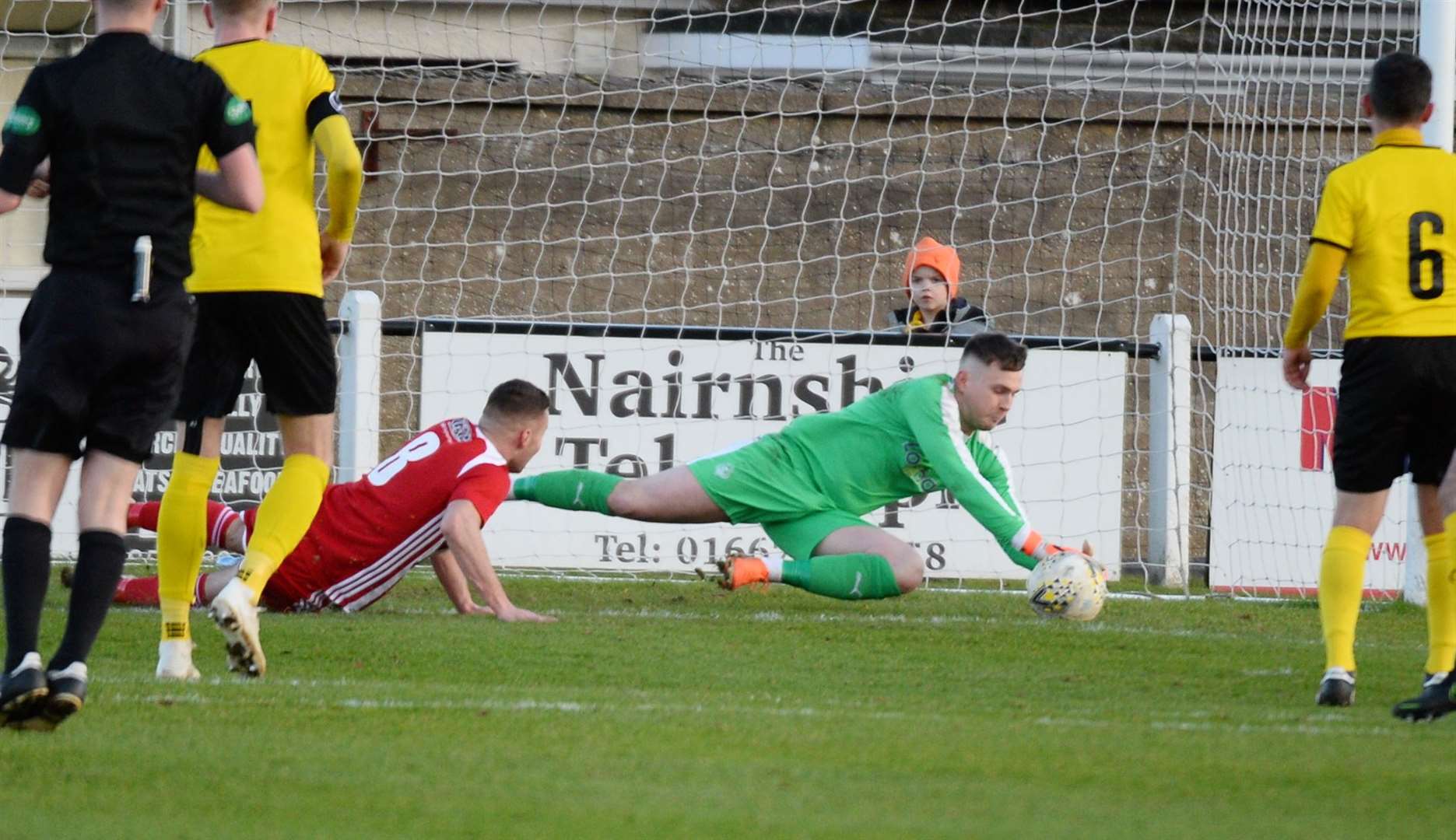 Wee County stopper Dylan Maclean makes a sharp save down low from Formartine United’’s Scott Lisle. Picture: Gary Anthony